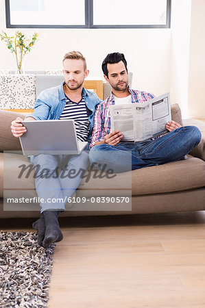 Gay couple relaxing on the couch