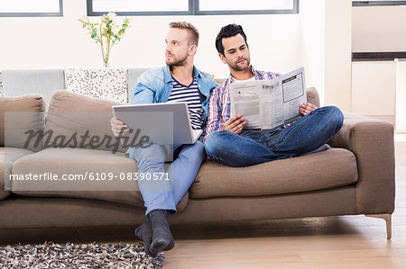 Gay couple relaxing on the couch