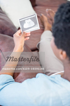Woman looking at an ultrasound picture