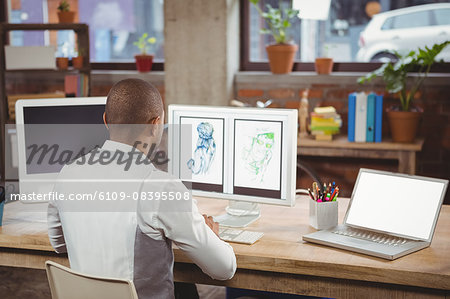 Cartoonist working on designs