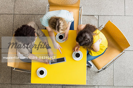 Students using tablet in the cafe