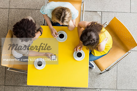 Students using smartphone in the cafe