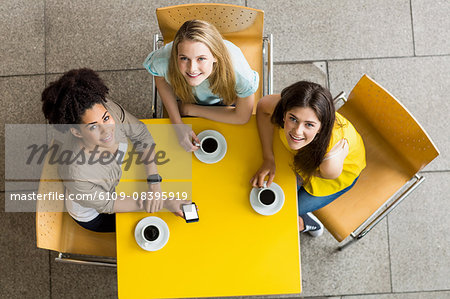 Students using smartphone in the cafe