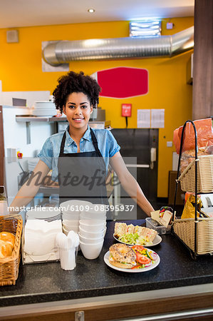 Pretty waitress smiling at camera