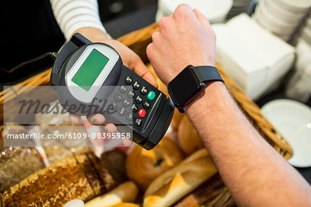 Customer paying with smart watch