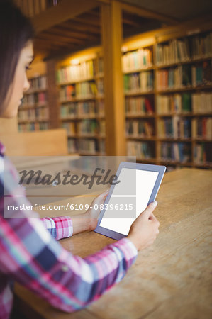 Female student holding digital tablet