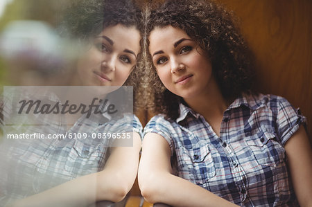 Pretty student sitting by the window