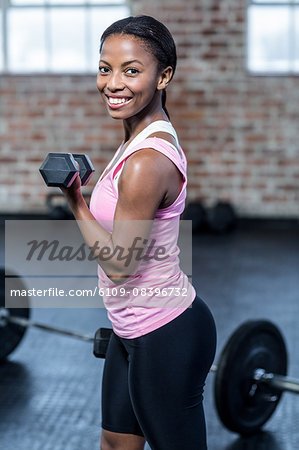 Fit smiling woman doing some exercise