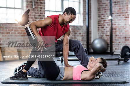 Fit couple doing a leg stretching