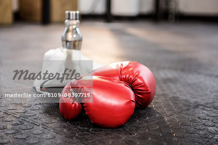 Boxing gloves on studio floor Boxing gloves on studio floor