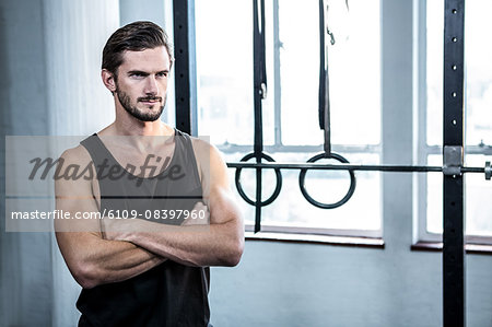 Fit man with arms crossed