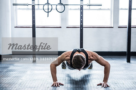 Fit man doing push ups