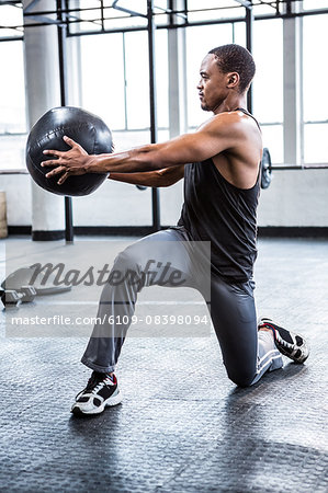 Fit man working out with ball