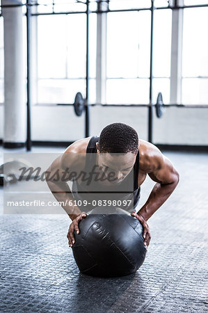 Fit man working out with ball