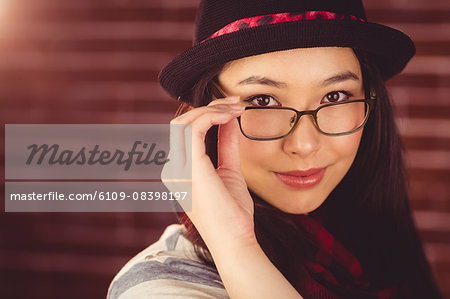 Attractive hipster posing with glasses