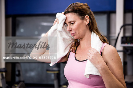 Pregnant woman wiping her sweating