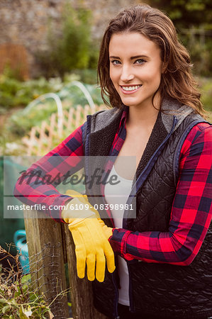 Smiling woman posing in her garden