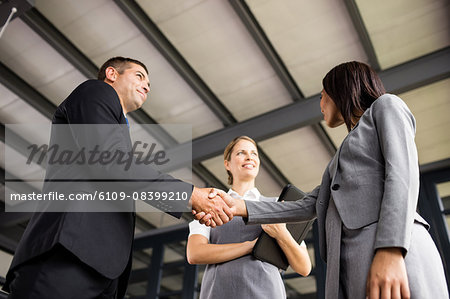 Business people talking together and shaking hands