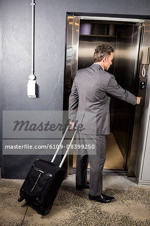 Businessman going in the lift