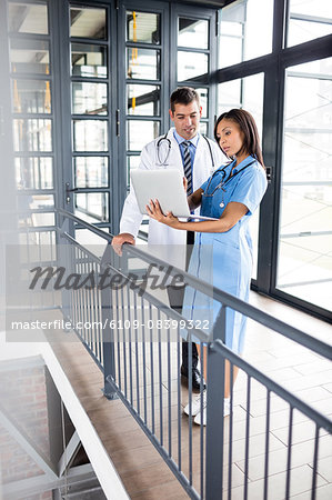 Nurse and doctor looking at a laptop