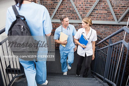 Serious medical team going upstairs