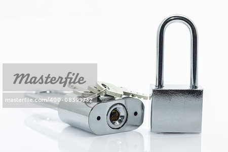 Metallic padlock with  keys on white background