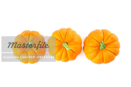 Decorative orange pumpkins, top view isolated on white background