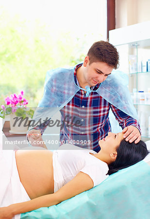 partner soothing pregnant woman during affiliate childbirth