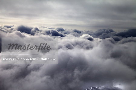 Top of off-piste slope in storm clouds. Georgia, ski resort Gudauri. Caucasus Mountains.