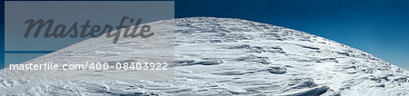 Mountain top panorama view on blue sky background.