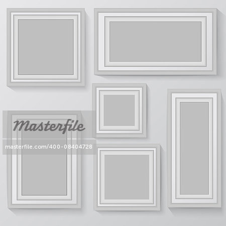 Set of white photo frames on grey background