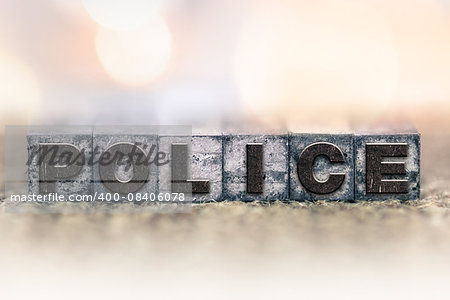 The word "POLICE" written in vintage ink stained letterpress type.