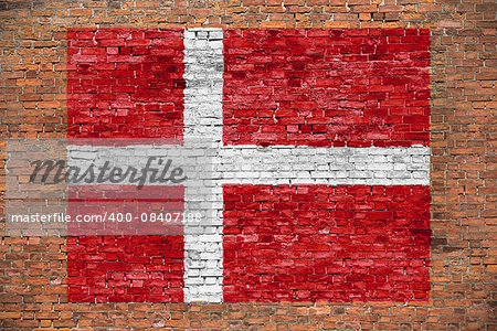 Flag of Denmark painted on old brick wall