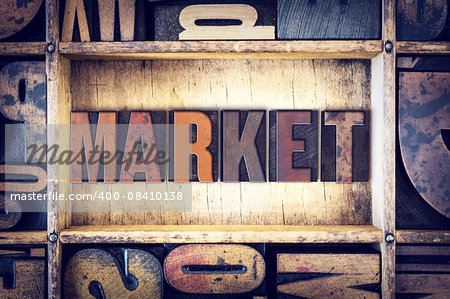 The word "Market" written in vintage wooden letterpress type.