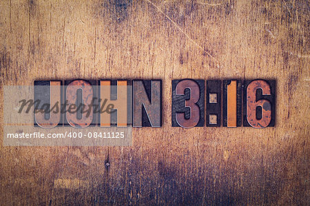 The verse "John 316" written in dirty vintage letterpress type on a aged wooden background.