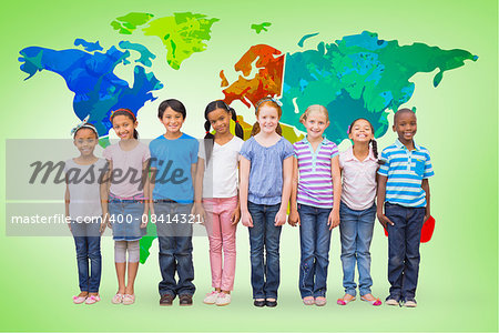 Cute pupils smiling at camera in classroom against green vignette