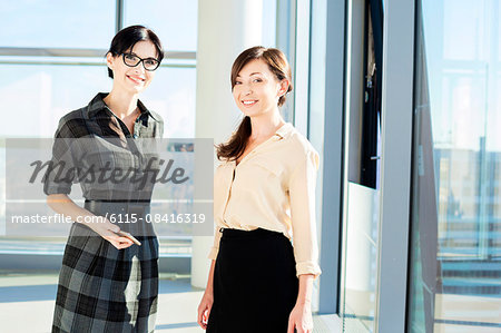 Portrait of two female architects in modern office