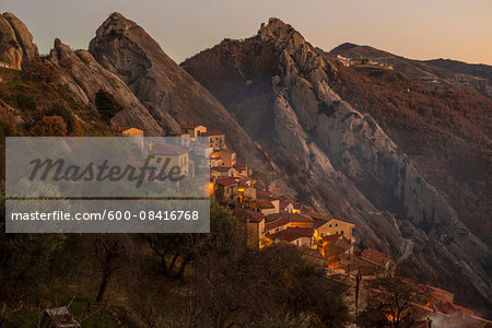 Scenic view of the sandstone rocks and mountain village of Castelmezzano at sunset, Lucanian Dolomites, Basilicata, Italy