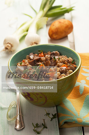 Grain soup with mushrooms, carrots, onions and potatoes