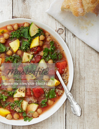 Vegan minestrone soup with kale, courgette, chickpeas and quinoa Vegan minestrone soup with kale, courgette, chickpeas and quinoa