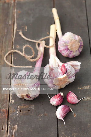Bulbs of garlic on a rustic wooden table