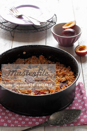 Plum crumble in baking dish