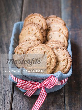 Healthy cardamom biscuits stamped with the word 'Sweet'