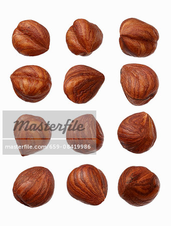Twelve hazelnuts on a wooden surface