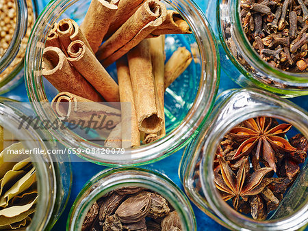 Jars of spices for hot winter drinks such as mulled wine or punch