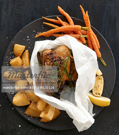 Roast chicken with roast potatoes and carrots Roast chicken with roast potatoes and carrots