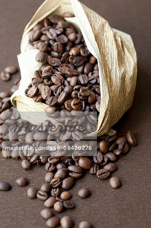 Coffee beans falling out of a sack