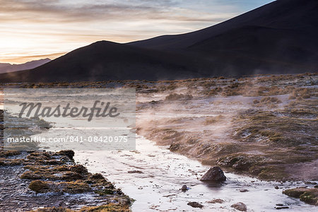 Geothermal river at sunrise at Chalviri Salt Flats (Salar de Chalviri), Altiplano of Bolivia, South America