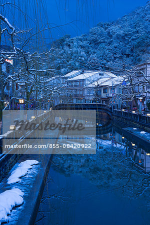 Snow on Otani river at night, Kinosaki Onsens (Hot springs) in winter. Kinosaki Hyogo Prefecture, Kansai, Japan