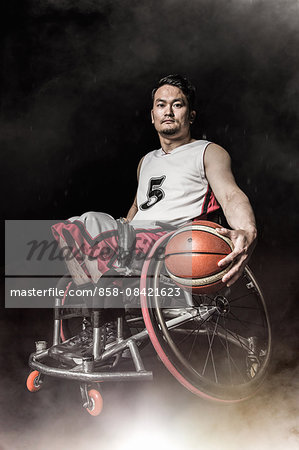 Wheelchair basketbal player with the ball